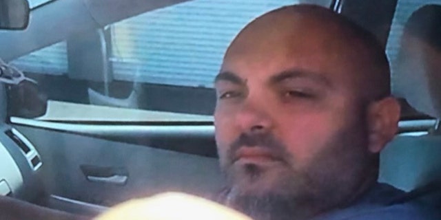 Unidentified Man on storage unit surveillance image
