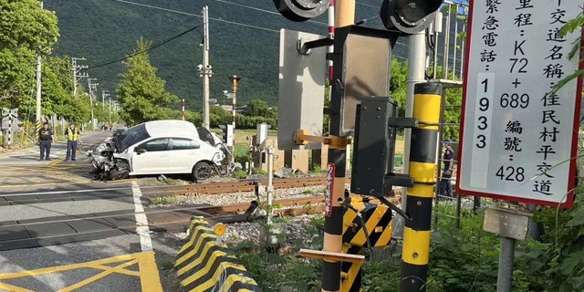 Damaged car near crossing