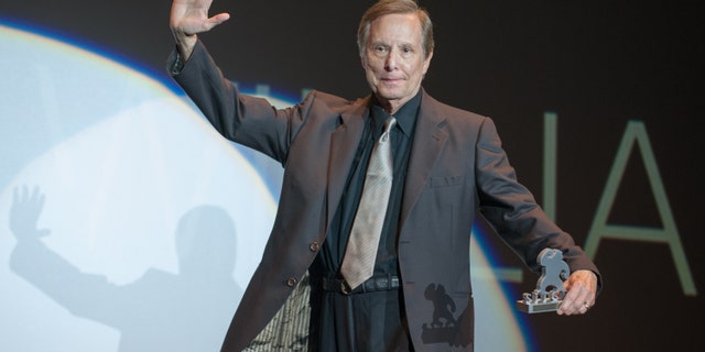 William Friedkin on stage accepting an award