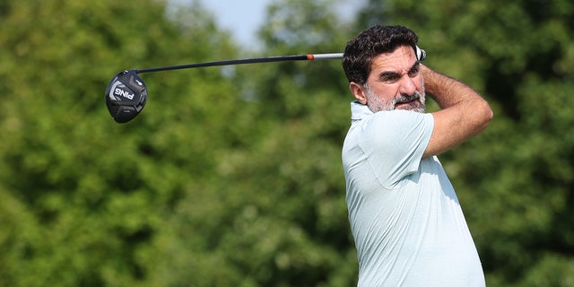 Yasir Al-Rumayyan swings golf club