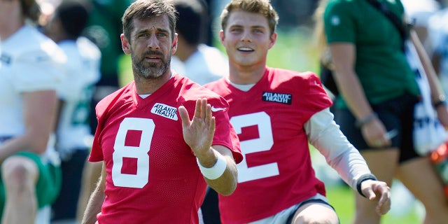 Aaron Rodgers and Zach Wilson