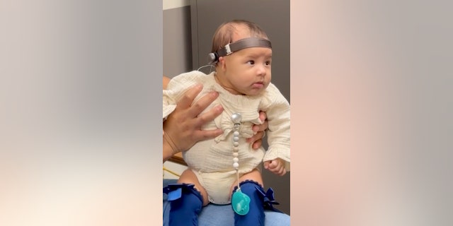 Baby hears for the first time