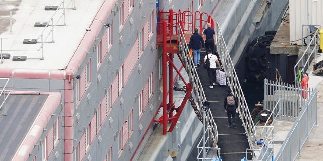 People board the Bibby Stockholm