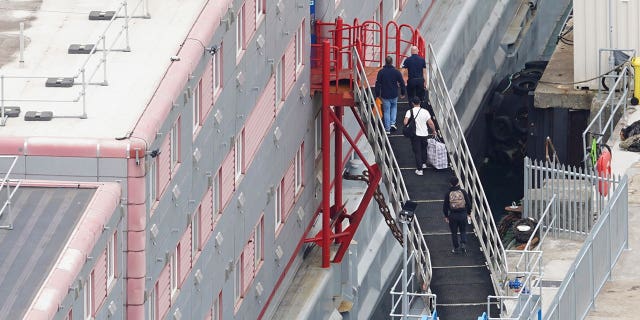 People board the Bibby Stockholm 