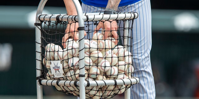 A basket filled with baseballs