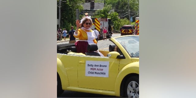 Betty Ann Bruno in a car in a parade