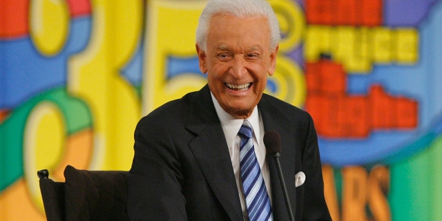 Bob Barker sits on Price is Right set