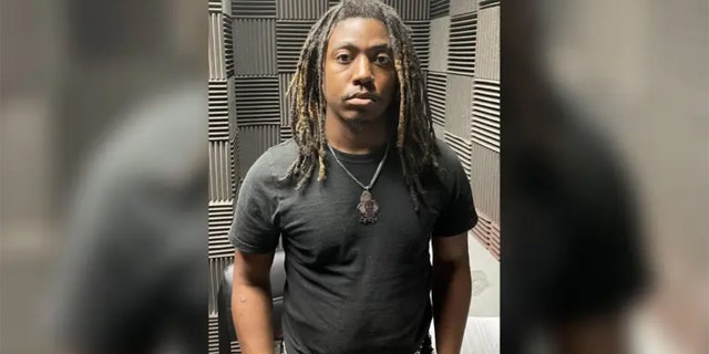 Cedarius Glaze, 28, is pictured wearing a black t-shirt