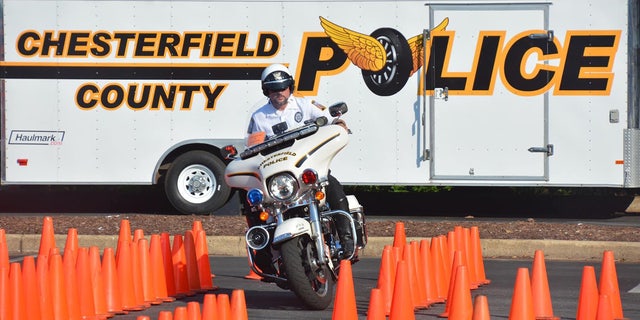Chesterfield County police officer on a motorcycle navigating traffic cones
