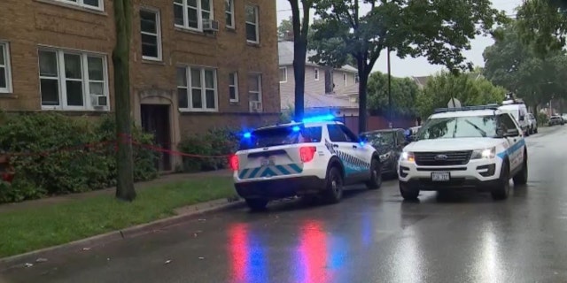 police cars outside apartment building