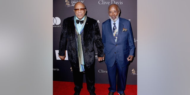 Quincy Jones and Clarence Avant hold hands at Clive Davis' 2019 Pre-GRAMMY Gala