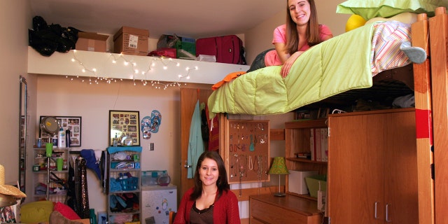College roommates hanging out in their dorm
