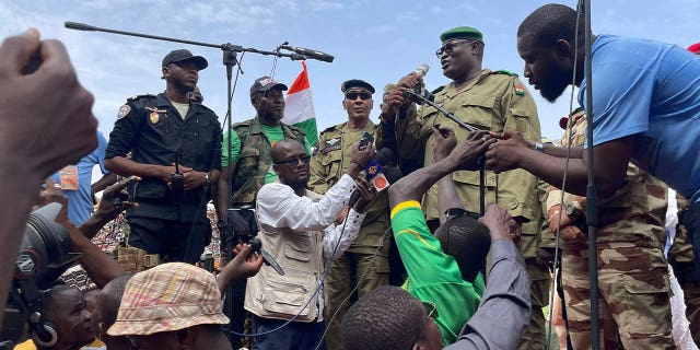 soldier speaks to supporters