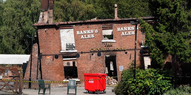 Crooked House pub remains