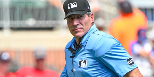 Angel Hernandez walks