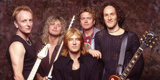 Old picture of Def Leppard Phil Cohen, Rick Savage, Joe Elliot center, Rick Allen and Vivian Campbelll