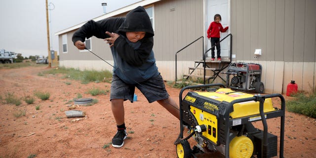 boy starts generator