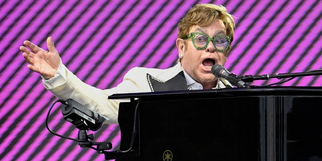 Elton John playing piano