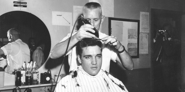 Elvis Presley gets his hair cut in the Army