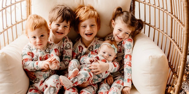 family of five children in matching Christmas pajamas