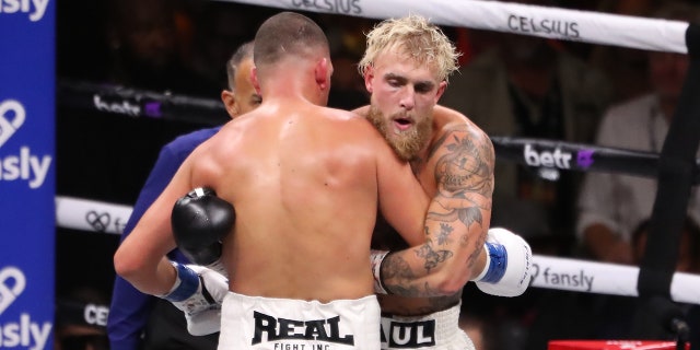 Jake Paul hugs Nate Diaz