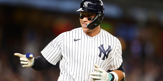 Aaron Judge points at dugout