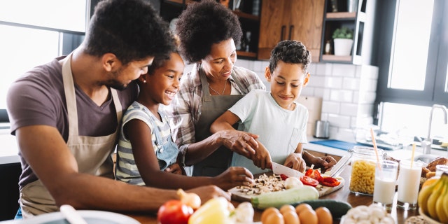 cracking egg trend family in kitchen