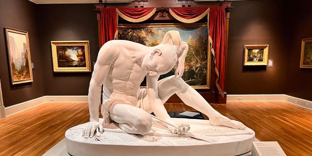 Wounded Indian sculpture
