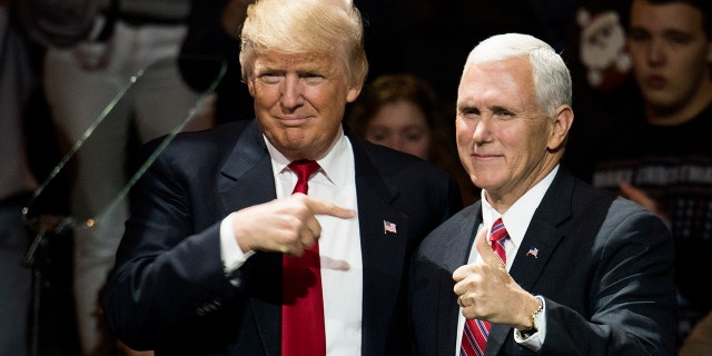 President-elect Donald Trump and Vice President-elect Mike Pence stand onstage