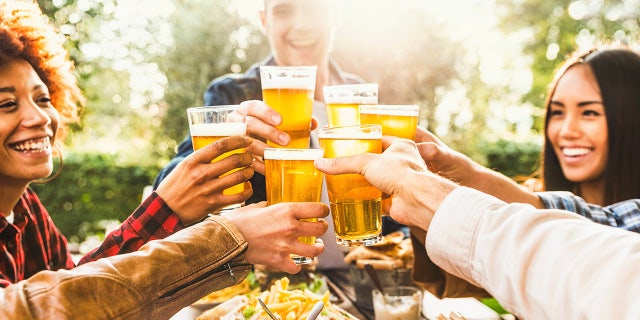 friends celebrate with beer