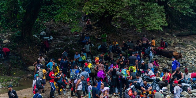 Migrants cross through Darien Gap