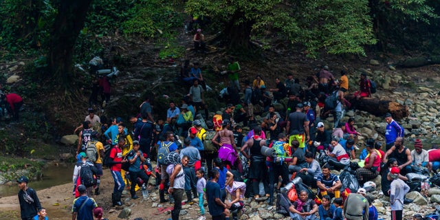 Migrants cross through Darien Gap