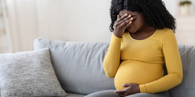 Pregnant woman suffering