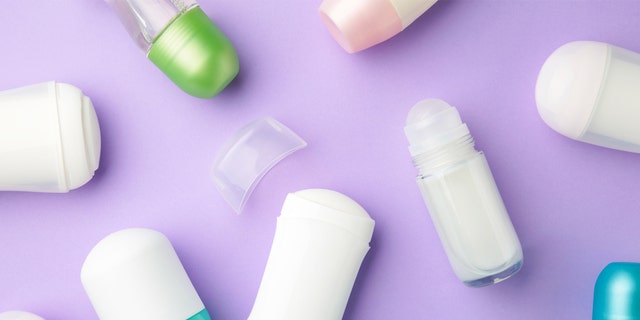 Antiperspirants and deodorants set on a purple background.