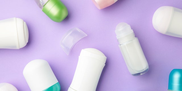 Antiperspirants and deodorants set on a purple background.