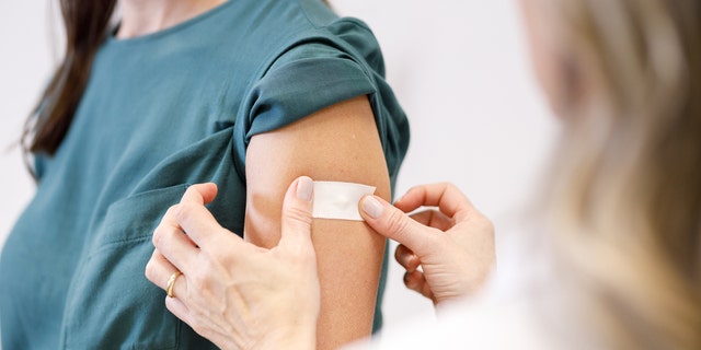 Woman getting vaccine