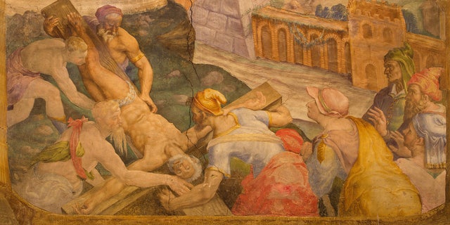 a painting depicting the upside-down crucifixion of St. Peter