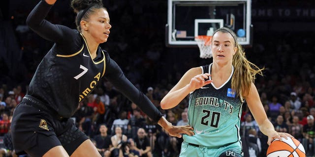 Sabrina Ionescu dribbles