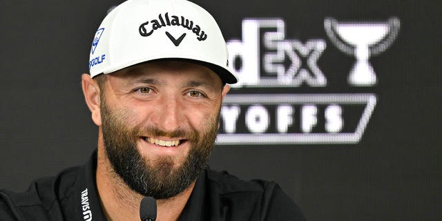 Jon Rahm talks to the media