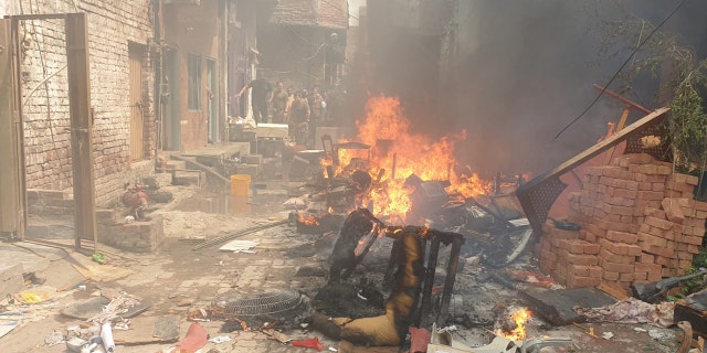 Chairs and other furniture and proprty is burned on the street in Pakistan