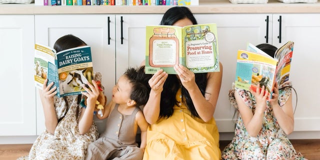 An Oregon homeschool family holding books