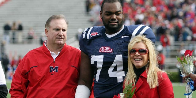 Michael Oher stands with his family ahead of an Ole miss game