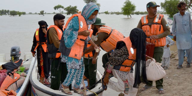 rescue team evacuates residents