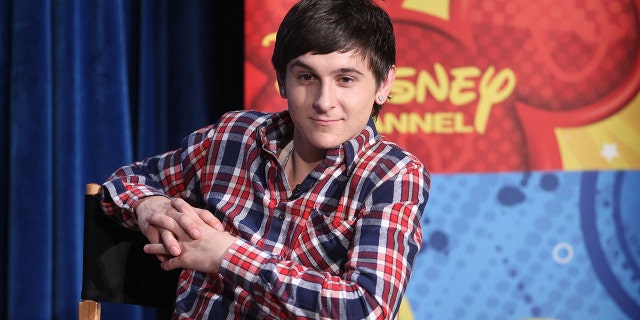 Mitchel Musso sits in Disney directors chair