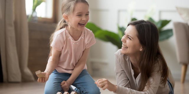 Mom playing with child