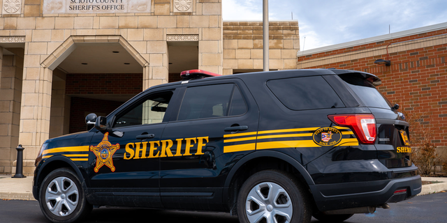 Sheriff 's SUV outside sheriff's office building