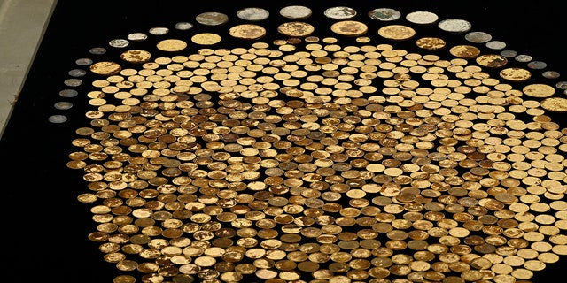 raw coins on black table