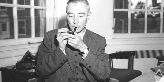 J. Robert Oppenheimer at his desk 