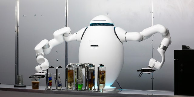 Robot bartender makes a cocktail