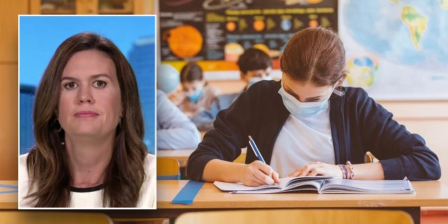 Sarah Huckabee Sanders over a student writing